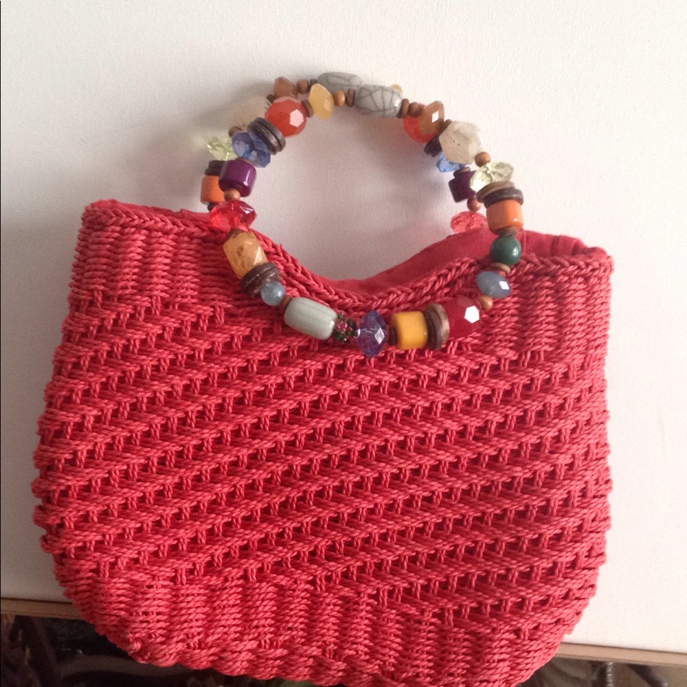 Unused new Cappelletti handbag. It is orange.